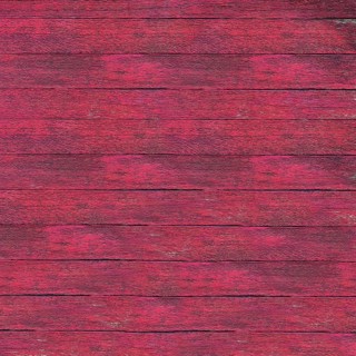Pink painted wooden boards creating a weathered, rustic background texture, ideal for design