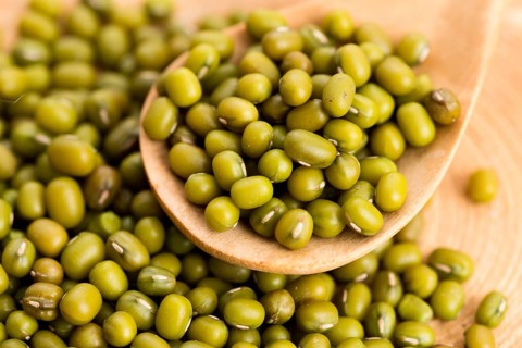 Mung beans over wooden spoon, lodz, poland