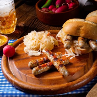 Rustic Thuringian bratwurst with sauerkraut and roll