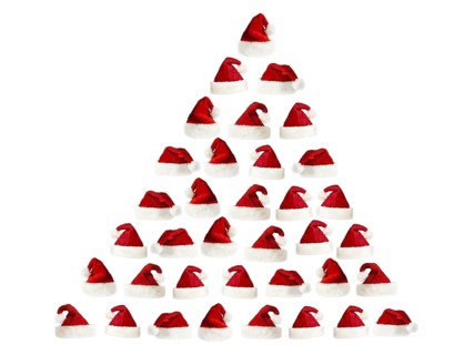 Isolated fluffy red Santa's hats over white
