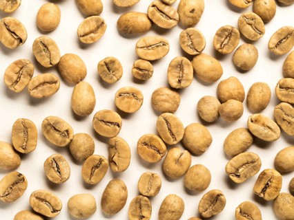 Top view of white coffee beans on white background