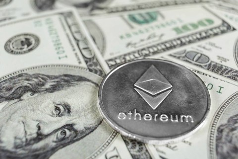Silver Ethereum macro photo on hundred dollars bills