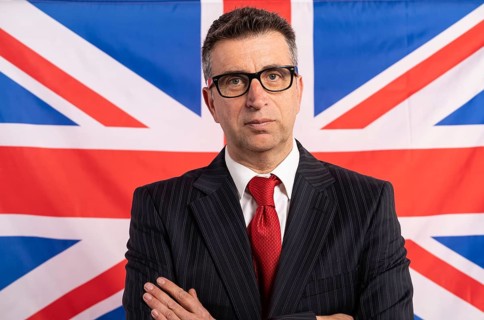 English UK businessman with suit on british flag