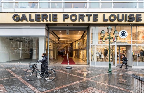 Brussels Old Town, Brussels Capital Region, Belgium, 12 12 2019 Woman with bicycle and pedestrians