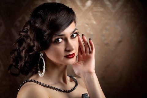 Retro woman portrait. Luxurious lady in the vintage style of the 20s or 30s