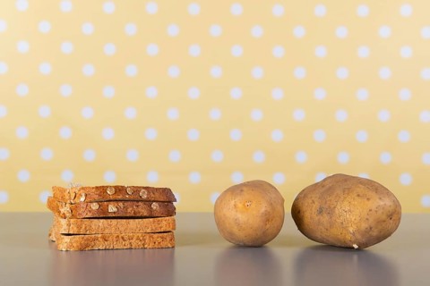 Bread and potatoes full of carbohydrates on the table