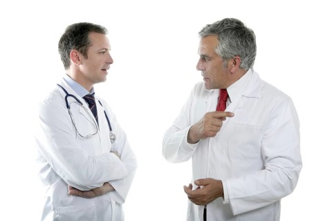 Doctors team talking expertise senior tie white background