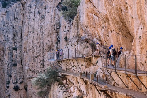 El Chorro, Spain, April 2023: People walking the Caminito Del Rey in the Desfiladero de los