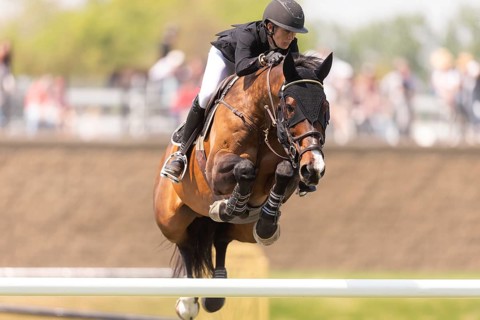 Katie Laurie of Australia and riding Django II, compete in the 1.60m Grand Prix during The