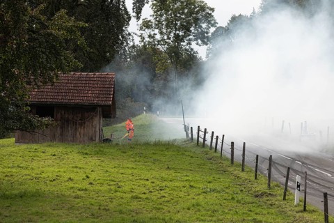 Track marshals in the fog at the 1st Malters hill climb in Malters, Lucerne, Switzerland, Europe