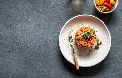 Food, Food, SALMON TARTAR with capers and purple onion on white plate, gray background