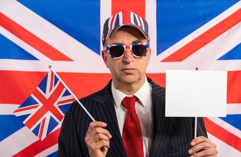 British male businessman with Brexit banner and UK flag