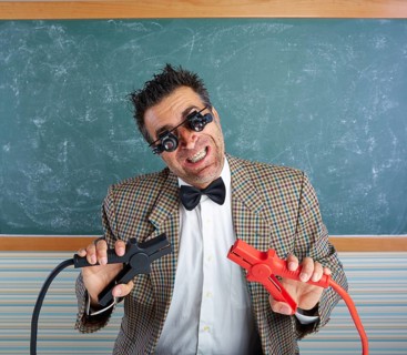 Nerd electronics technician retro teacher silly expression working battery clamps