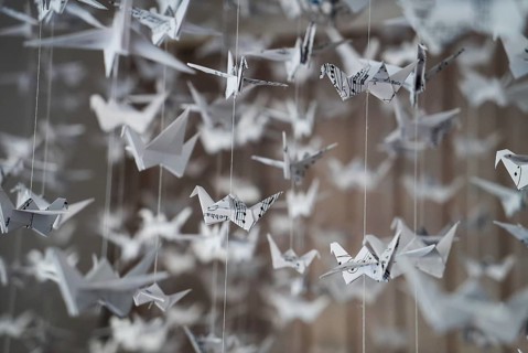 White Origami cranes paper closeup swarm macro photo