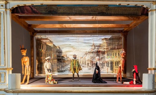 Vintage puppet show theatre made of wood. Old historical puppets