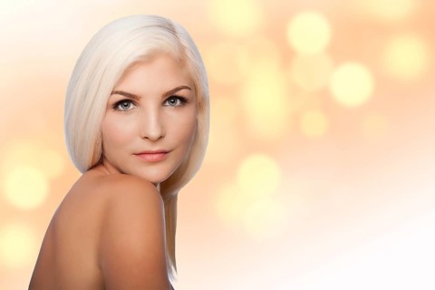 Beautiful face of young woman for Aesthetics facial skincare concept looking over shoulder, on