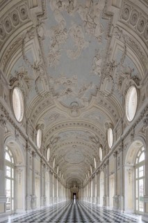 Magnificent, bright baroque corridor with ornately decorated ceiling, Palace of Venaria Reale,