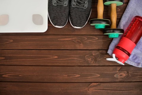 New life, sports paraphernalia on a wooden background, flat concept position