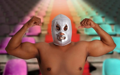 Mexican wrestling mask silver fighter gesture stadium bleachers seats
