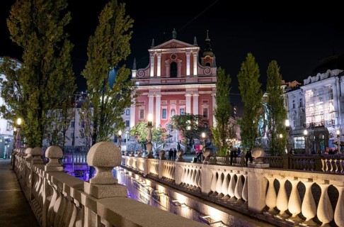 Famous Three Bridges and the Preseren square in the center of Ljubljana illuminated at night,