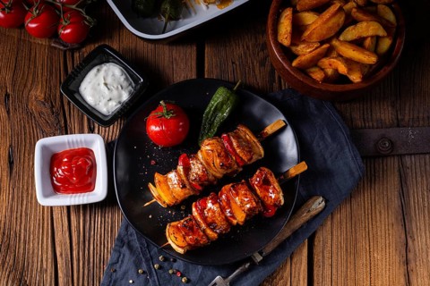 Marinated kebabs with meat and vegetables