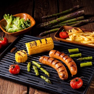 Grilled krakauer with french fries and green salad