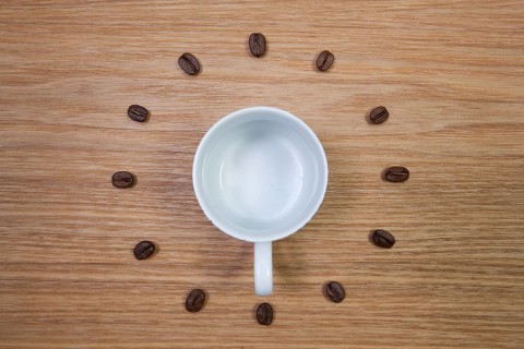 Coffee Time - Empty coffee cup and clock of coffee beans