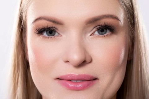 Closeup of an absolutely stunning woman displaying her radiant skin along with her pristine and