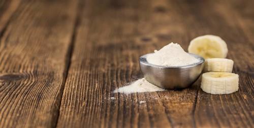 Banana Powder on rustic wooden background as close-up shot
