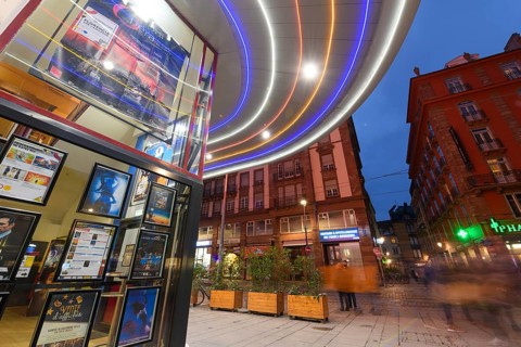 The Vox cinema in Strasbourg illuminated at night. Bas-Rhin, Alsace, Grand Est, France, Europe
