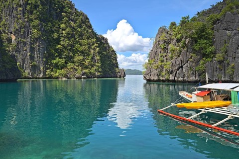 Coron Island Lagoon with a tourist boats at the pier