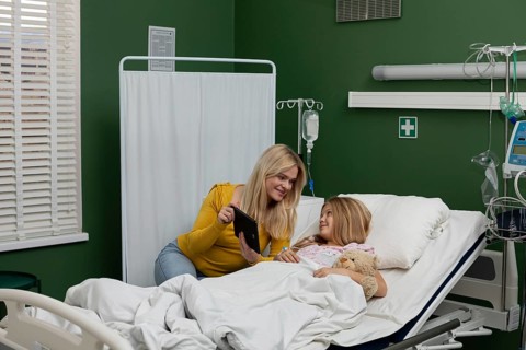 A touching and caring moment shared between a devoted mother and her beloved child within a
