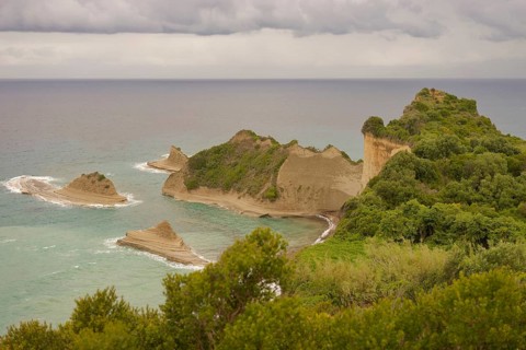 View of Cape Drastis, rock formation, limestone rock, rock, fan palm, spring, Peroulades,