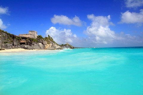 Ancient Mayan ruins temple of Tulum in Caribbean turquoise sea shore