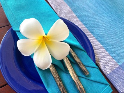 Food decoration with white plumeria rubra flower, Sri Lanka. Blue food decoration