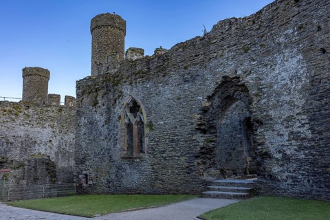 Conwy Castle, inner courtyard of the medieval castle ruins under a blue sky, Conwy, Wales, Great