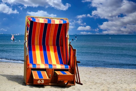 Beach chairs on Timmendorfer Strand on the Baltic sea with blue sky