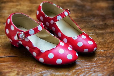 Red dance shoes with white dots
