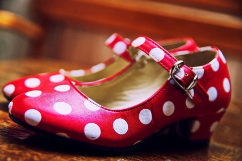 Red dance shoes with white dots