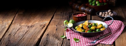 Brussels sprouts potato pan with bacon in a rustic style
