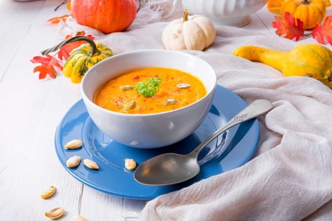 Healthy pumpkin soup with ginger, carrots and coconut milk