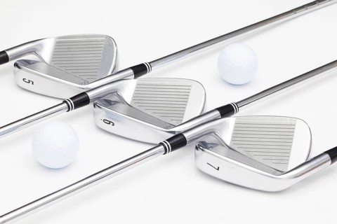 Titanium golf clubs on the white background
