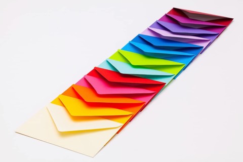 Different colored envelopes on the white background