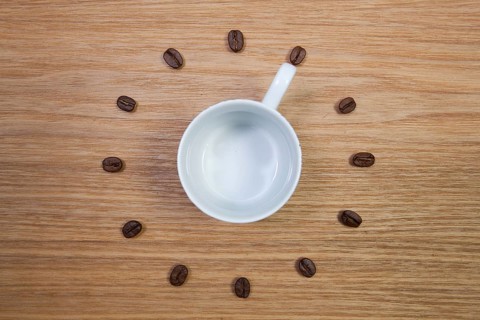 Coffee Time - Empty coffee cup and clock of coffee beans