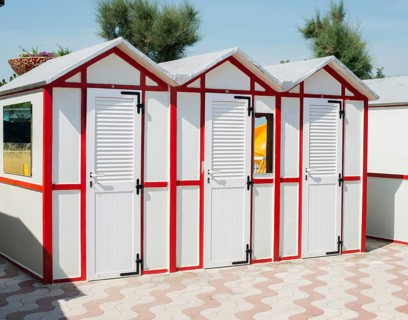 Red wooden cabins on the beach