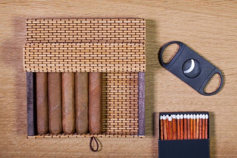 Luxury Cuban cigars on the wooden table