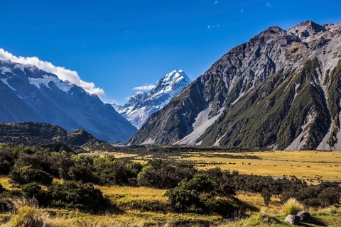 The concept of active, walking and photo tourism. The top of the mountain is covered with eternal