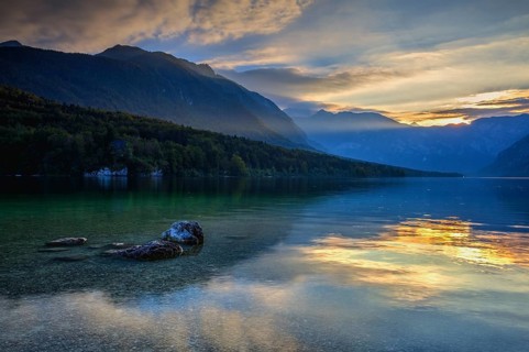 Dramatic sunset above the Bohinj Lake, Slovenia. It is located within the Bohinj Valley of the