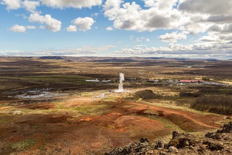 View on Geyser valley, Haukadalur geyser erupting