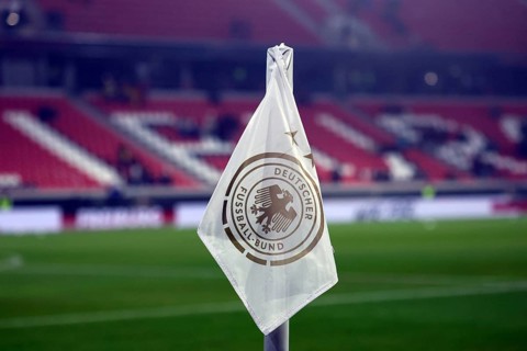 Showing the flag - the first international football match at the new Europa Park Stadium in